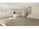 Open concept kitchen with island and hardwood floors at 18 Steppe Way, Garner, NC 27529