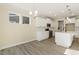 Modern white kitchen with island and stainless steel appliances at 18 Steppe Way, Garner, NC 27529