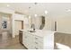 Modern kitchen with island, stainless steel appliances, and hardwood floors at 18 Steppe Way, Garner, NC 27529