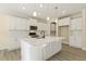 Open concept kitchen with island and stainless steel appliances at 18 Steppe Way, Garner, NC 27529