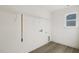 Laundry room with wire shelving and a window at 18 Steppe Way, Garner, NC 27529