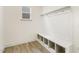 Laundry room with built-in bench and storage at 18 Steppe Way, Garner, NC 27529