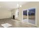 Living room with fireplace, hardwood floors, and sliding glass doors at 18 Steppe Way, Garner, NC 27529
