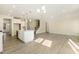 Open concept living room and kitchen with hardwood floors and natural light at 18 Steppe Way, Garner, NC 27529