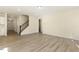 Bright living room with hardwood floors and staircase at 18 Steppe Way, Garner, NC 27529