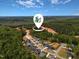 Aerial view of a new construction neighborhood surrounded by lush green forest at 367 W Amber Oak Dr # 53, Selma, NC 27576