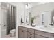 Bathroom featuring a double vanity, neutral-toned cabinets, and a shower-tub combination at 367 W Amber Oak Dr # 53, Selma, NC 27576