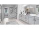Bright bathroom featuring a double vanity, modern fixtures, and an adjoining room at 367 W Amber Oak Dr # 53, Selma, NC 27576