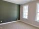 Empty bedroom with two large windows lets in tons of natural light at 367 W Amber Oak Dr # 53, Selma, NC 27576
