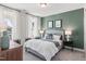 Comfortable bedroom with neutral carpet, and white curtains at 367 W Amber Oak Dr # 53, Selma, NC 27576