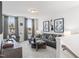 Relaxing bonus room featuring gray sofa, modern decor and plenty of natural light at 367 W Amber Oak Dr # 53, Selma, NC 27576