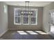 Bright dining room with modern light fixture offers inviting space at 367 W Amber Oak Dr # 53, Selma, NC 27576