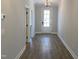 Inviting entryway with hardwood floors and a glass paneled front door at 367 W Amber Oak Dr # 53, Selma, NC 27576