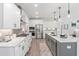 Modern kitchen showcasing white cabinets, stainless appliances and a spacious center island at 367 W Amber Oak Dr # 53, Selma, NC 27576