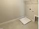 Compact laundry room with tile flooring and essential appliance connections at 367 W Amber Oak Dr # 53, Selma, NC 27576