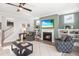 Inviting living room with a fireplace and access to the staircase at 367 W Amber Oak Dr # 53, Selma, NC 27576
