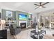Cozy living room featuring a fireplace, built-in shelves, and outdoor access at 367 W Amber Oak Dr # 53, Selma, NC 27576