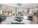 Spacious living room with hardwood floors, and a cozy kitchen in the background at 367 W Amber Oak Dr # 53, Selma, NC 27576
