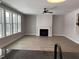 Bright living room features a fireplace, ceiling fan, and lots of natural light at 367 W Amber Oak Dr # 53, Selma, NC 27576