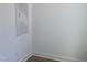 Minimalist room with white walls, white trim and a grey door at 367 W Amber Oak Dr # 53, Selma, NC 27576
