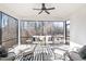 Bright sunroom with comfortable seating, ceiling fan, and views of nature at 367 W Amber Oak Dr # 53, Selma, NC 27576
