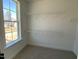 This walk-in closet features a window for natural light and wire shelving for storage at 367 W Amber Oak Dr # 53, Selma, NC 27576