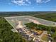 Stunning aerial view of a new construction community with lush greenery, clearly marked lot, and beautiful homes at 399 W Amber Oak Dr # 52, Selma, NC 27576