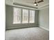 Spacious bedroom featuring triple window setup at 399 W Amber Oak Dr # 52, Selma, NC 27576