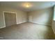 Unfurnished bedroom showing neutral carpet, walls and double door closet at 399 W Amber Oak Dr # 52, Selma, NC 27576