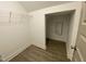 Walk-in closet with ample storage space, wire shelving, and modern flooring at 399 W Amber Oak Dr # 52, Selma, NC 27576