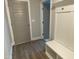 Foyer featuring bench, storage, coat hooks and grey door at 399 W Amber Oak Dr # 52, Selma, NC 27576