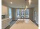 Kitchen featuring a white island with a sink, elegant pendant lighting, and a scenic view from the window at 399 W Amber Oak Dr # 52, Selma, NC 27576