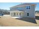 Beautiful backyard view showcasing covered patio area, lawn and home's exterior at 135 Newport Lndg, Garner, NC 27529