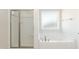 Bathroom with a separate glass shower and a soaking tub next to a bright window at 135 Newport Lndg, Garner, NC 27529