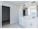 Bathroom featuring double sink vanity, large mirror, tiled floors, and closet at 135 Newport Lndg, Garner, NC 27529