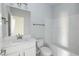 Bathroom featuring single sink vanity, large mirror, and shower-tub combo at 135 Newport Lndg, Garner, NC 27529