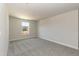 Bedroom featuring neutral walls, gray carpet, and a window at 135 Newport Lndg, Garner, NC 27529