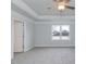 This bright main bedroom features neutral walls, soft carpet and tray ceilings at 135 Newport Lndg, Garner, NC 27529