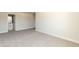 Carpeted bedroom with ample space, neutral walls, and an en-suite bathroom at 135 Newport Lndg, Garner, NC 27529