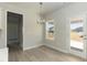 Cozy breakfast nook with natural light and outdoor access, perfect for casual dining at 135 Newport Lndg, Garner, NC 27529