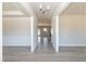 Bright hallway featuring hardwood floors, white trim and an open concept design at 135 Newport Lndg, Garner, NC 27529