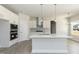 Kitchen features white cabinetry, subway tile backsplash, and a large kitchen island at 135 Newport Lndg, Garner, NC 27529