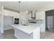 Modern kitchen featuring white cabinetry, quartz countertops and stainless steel appliances at 135 Newport Lndg, Garner, NC 27529