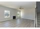 Spacious living room with fireplace, lots of light and neutral colors at 135 Newport Lndg, Garner, NC 27529