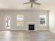 Inviting living room with a cozy fireplace, abundant natural light, and neutral flooring at 135 Newport Lndg, Garner, NC 27529