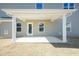 Covered patio with white pillars and a concrete floor perfect for entertaining outdoors at 135 Newport Lndg, Garner, NC 27529