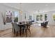 Bright dining room with hardwood floors and large windows at 700 W North St # 101, Raleigh, NC 27603