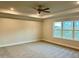 Spacious bedroom with carpeted floor and large window at 84 Rosslyn Way # 92, Garner, NC 27529