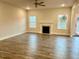 Spacious living room with hardwood floors and a fireplace at 84 Rosslyn Way # 92, Garner, NC 27529