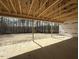Unfinished outdoor living space with lumber construction and an exposed ceiling set among tall trees at 1275 Cameron Hill Rd, Cameron, NC 28326